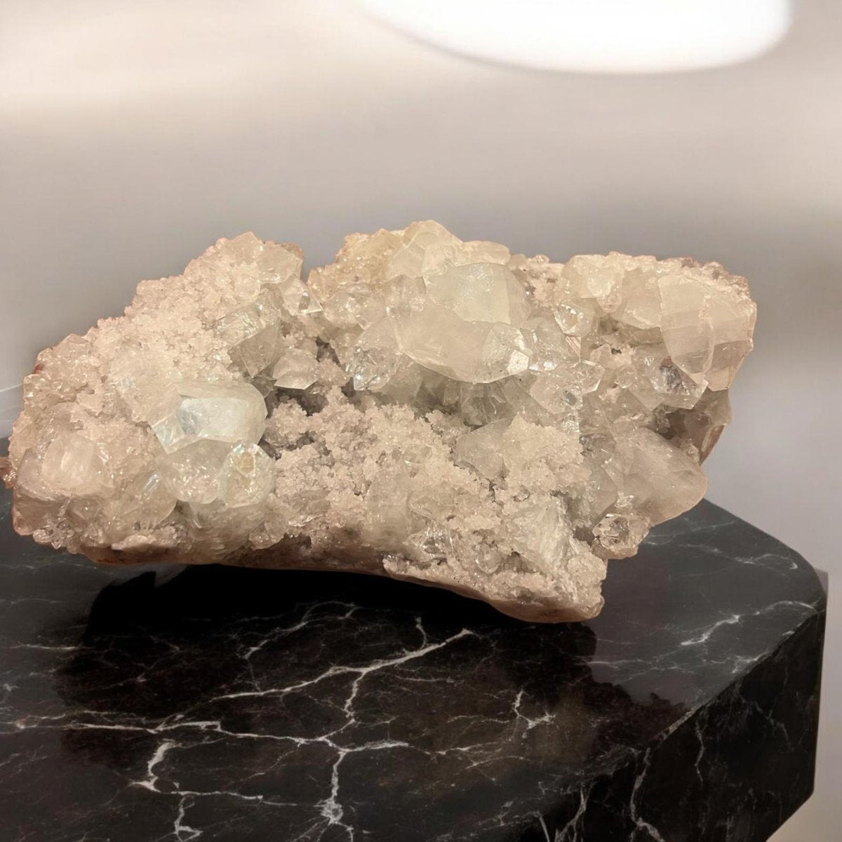 Apophyllite crystal cluster showcasing its transparent and greenish hues, symbolizing clarity and spiritual connection