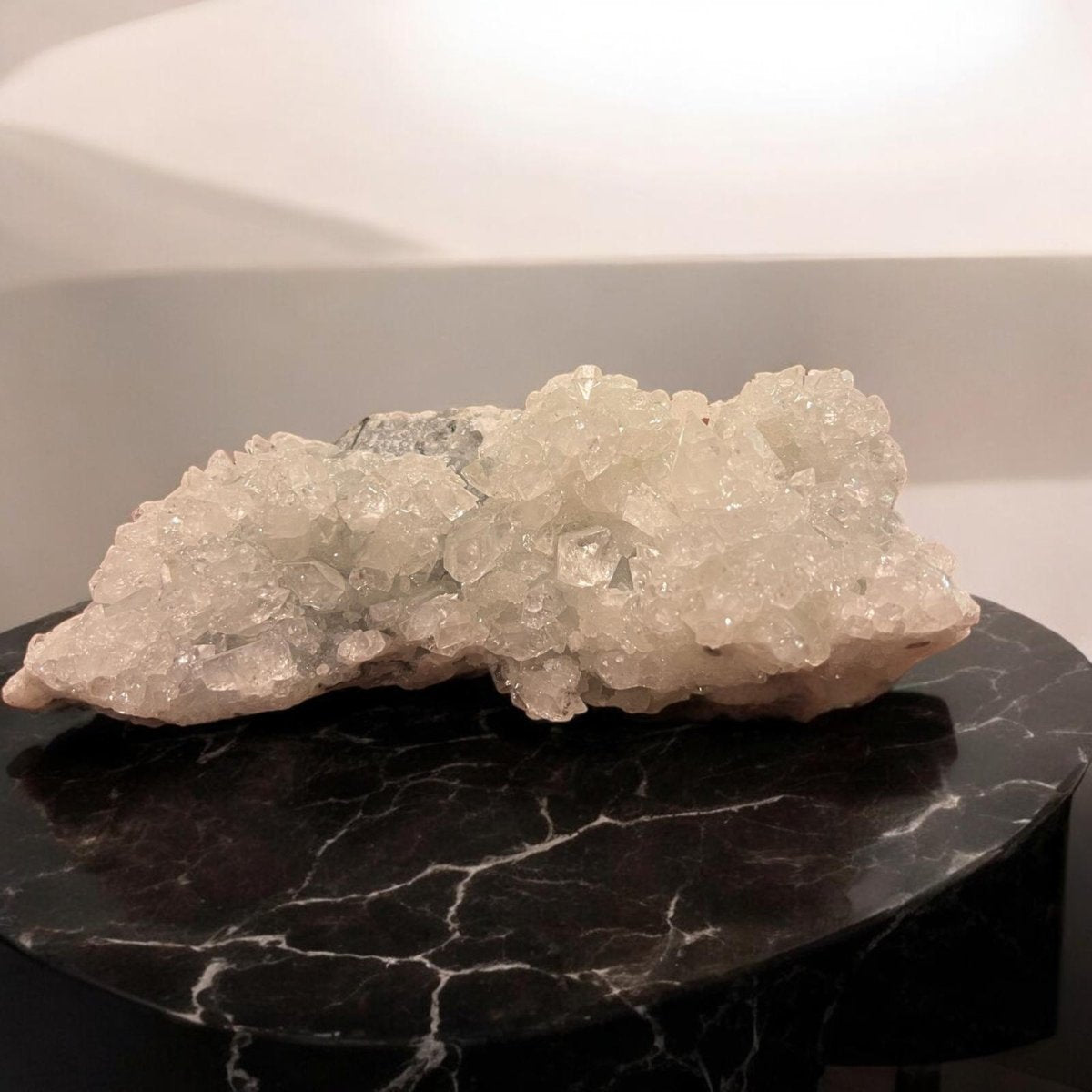 Apophyllite crystal cluster showcasing its transparent and greenish hues, symbolizing clarity and spiritual connection