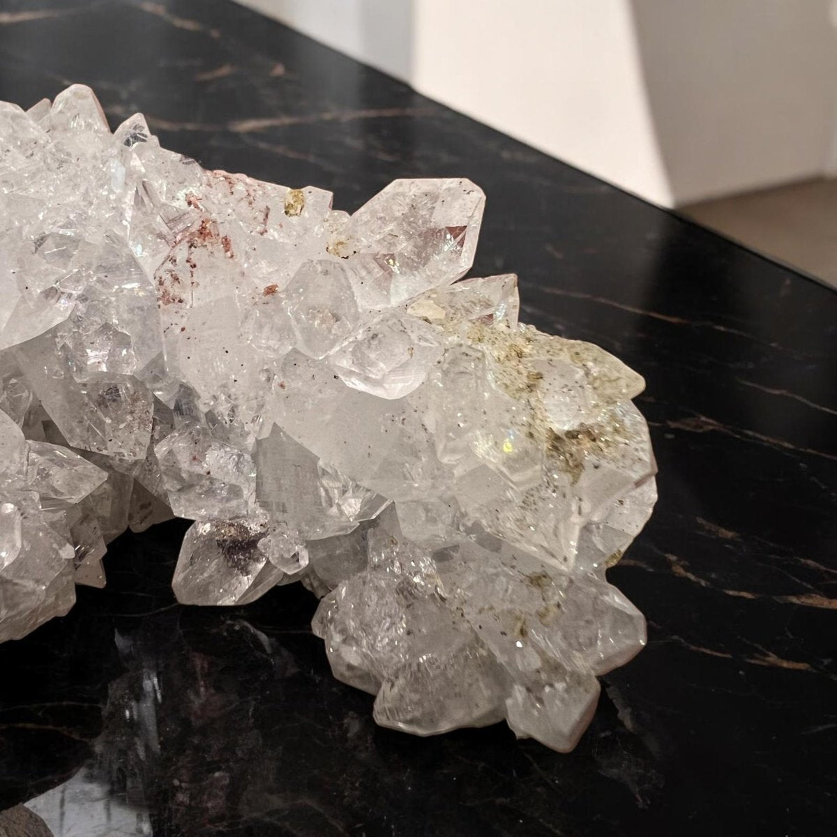 Apophyllite crystal cluster showcasing its transparent and greenish hues, symbolizing clarity and spiritual connection