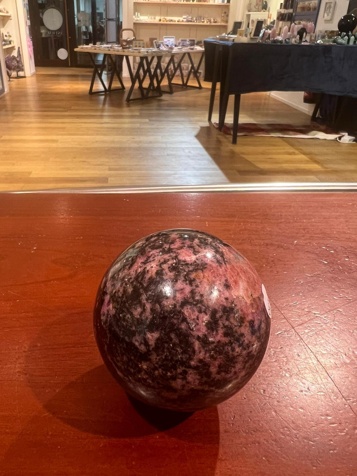 Rhodonite Sphere ( 652g ) - Crystals By Astraea