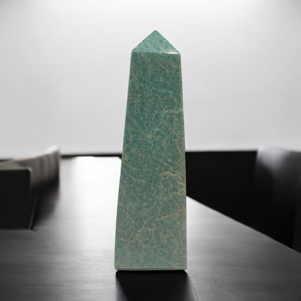 A stunning crystal tower, featuring sharp edges and a transparent surface, reflecting light beautifully, symbolizing strength and communication