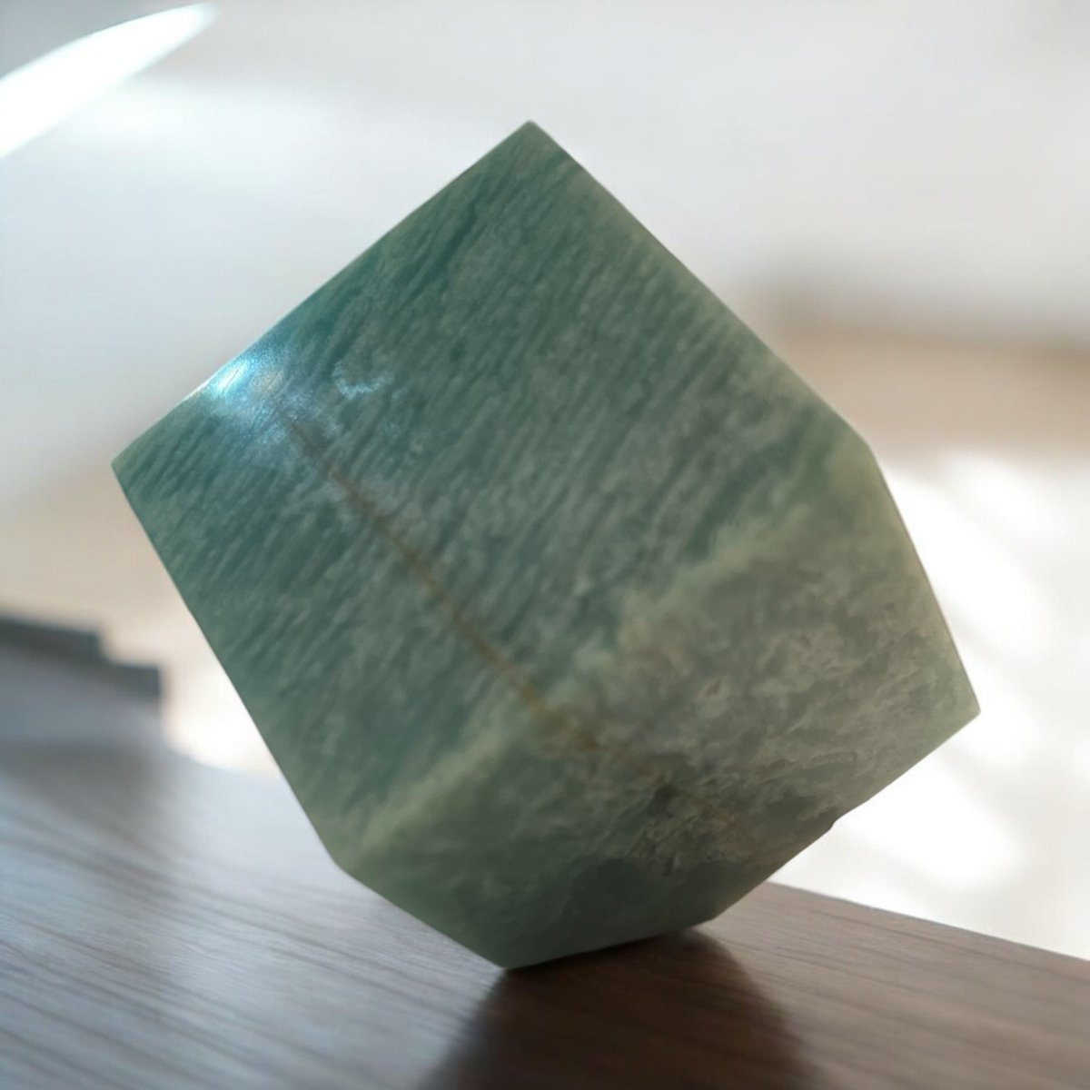 Polished Amazonite cubes, exhibiting vibrant blue-green hues and smooth surfaces, symbolizing stability and grounding energy while enhancing your meditation and healing practices