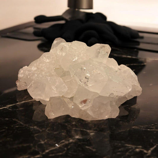 Apophyllite crystal cluster showcasing its transparent and greenish hues, symbolizing clarity and spiritual connection