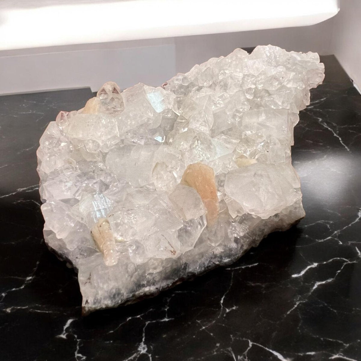 Apophyllite crystal cluster showcasing its transparent and greenish hues, symbolizing clarity and spiritual connection