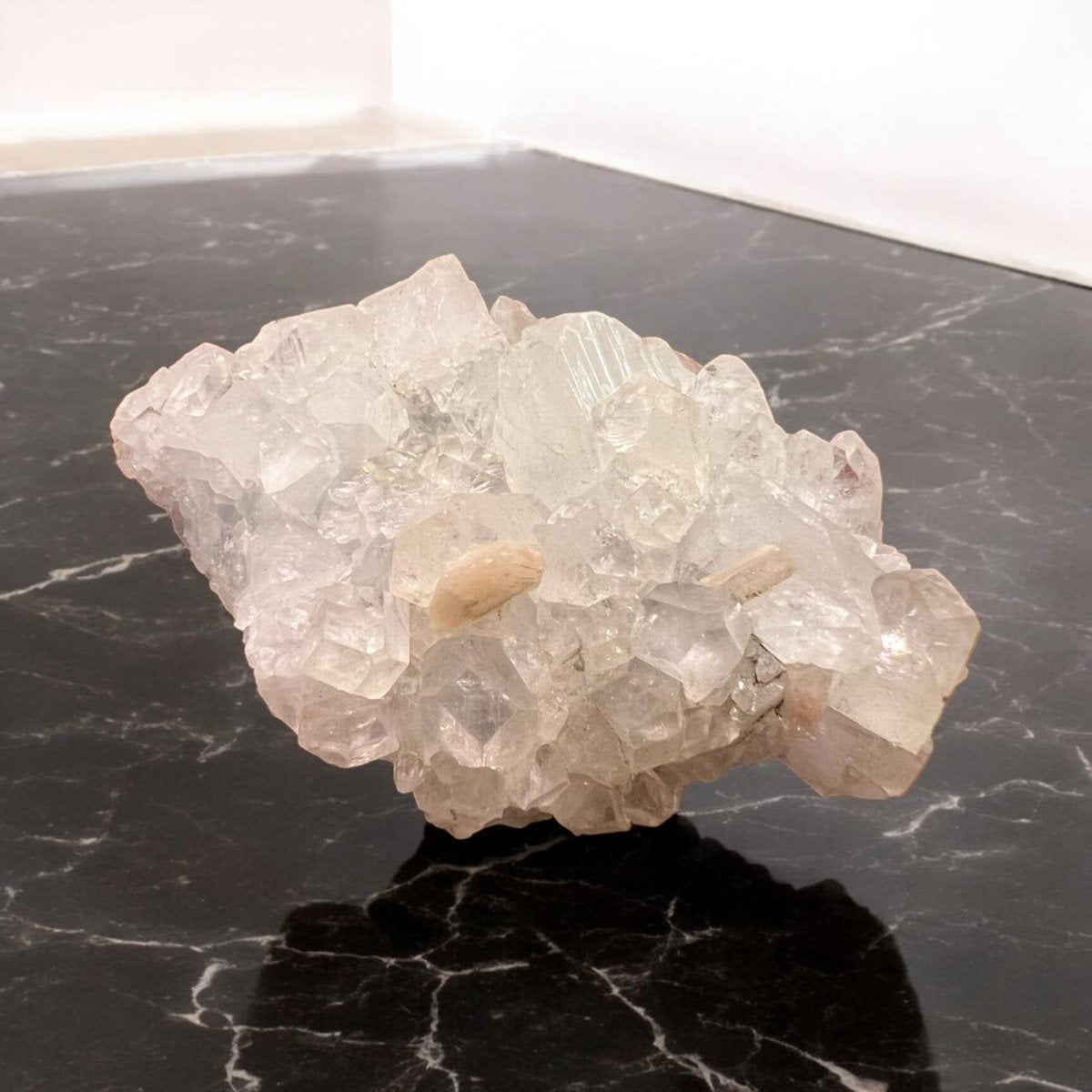 Apophyllite crystal cluster showcasing its transparent and greenish hues, symbolizing clarity and spiritual connection